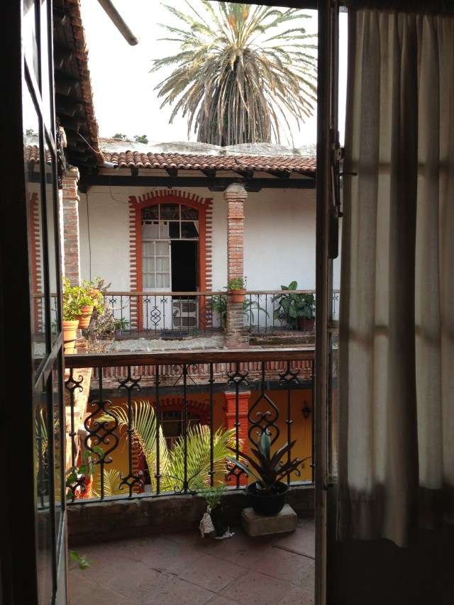 Looking out from my 2nd-floor apartment to the courtyard.