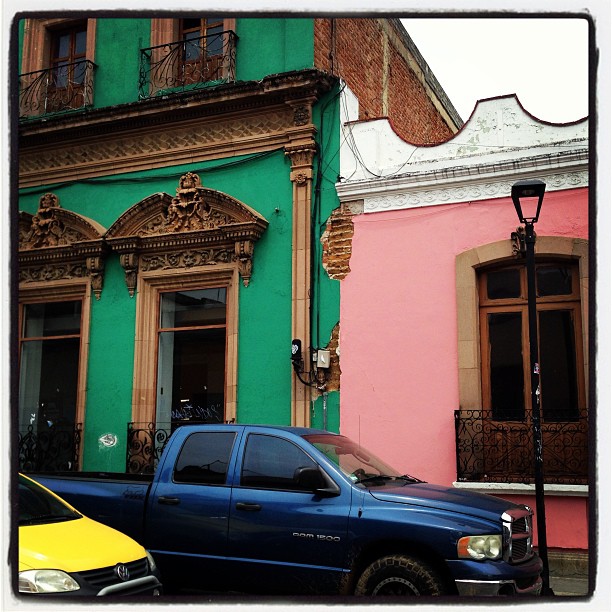 green and pink buildings