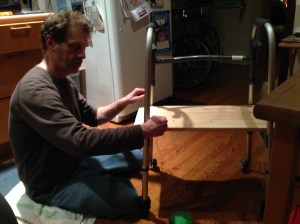 David constructs a knee platform for me on his mom's unused walker.