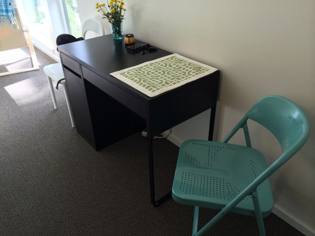 The included desk is now my eating area, with the cupboard serving as my pantry.