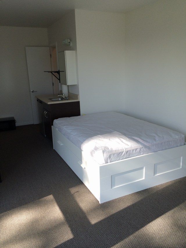 Huge drawers under the bed on both sides. The mattress is thicker than it looks because it's seated inside the bed unit