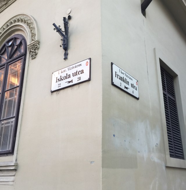 street signs on the corners of buildings