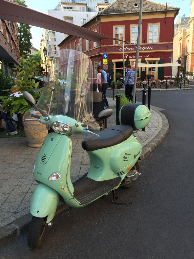 Pretty light green Vespa.