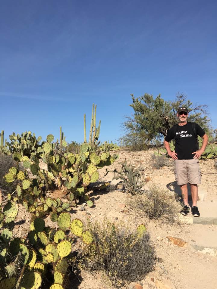 Man with black t-shirt in the Tucson desert.